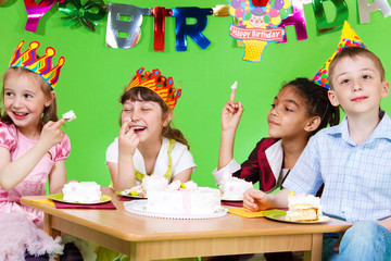 Kids eating  cake