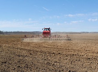 Fototapeta premium Tractor on a field.