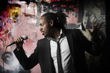 man posing with a microphone