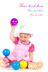 Fototapeta na wymiar Baby girl playing with balls