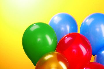Flying balloons  on a yellow background
