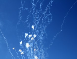 blue sky with fireworks firecrackers white clouds