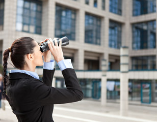 businesswoman looks into the future
