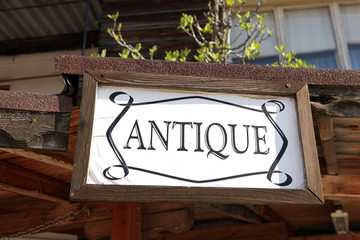 Sign with text 'antiques'