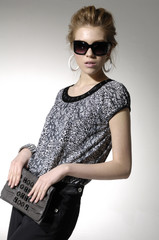 Close up fashion model wearing modern sunglasses