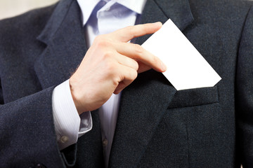 Blank card in businessmen hand