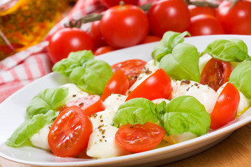 salad with mozzarella, basil and tomatoes