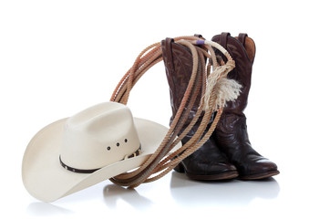 Cowboy hat, boots and lariat on white - 32453088