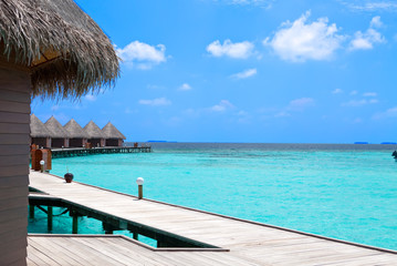 Island in ocean, overwater villas