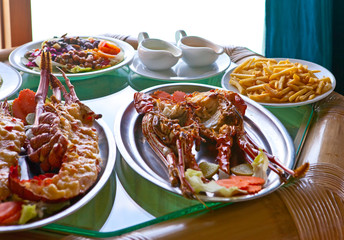 plates with lobster on table