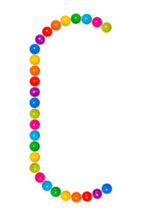 Letter C from plastic children's balls on the white