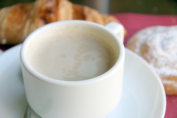 Coffee with croissant and ensaimada pastry from Spain