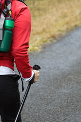 Woman on nordic walking trip in mountains