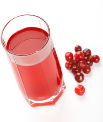 Glass of cranberry juice on a white background