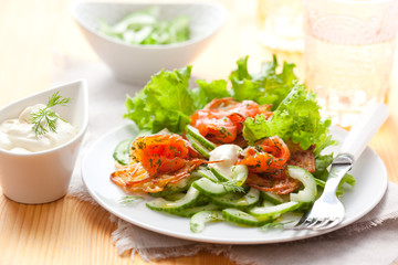 Potato rosti with smoked salmon and cucumber salad