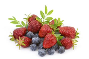 Fototapeta na wymiar Strawberries and blueberries isolated on white