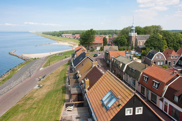 Seafront of a Dutch fishing village seen from the Lighthouse - obrazy, fototapety, plakaty