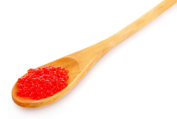 Red caviar on spoon isolated on white