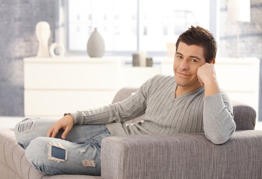 Portrait of happy man on couch