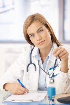Portrait of attractive female doctor in office