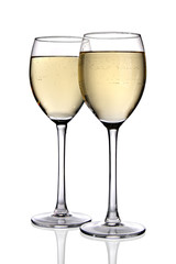 Two glasses of white wine isolated over white. Front view. Clipping path