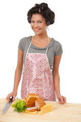 Beautiful cooking woman in apron with sandwich.