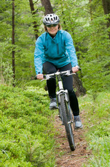 Obraz premium Woman bike riding