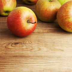 red apples on wooden table
