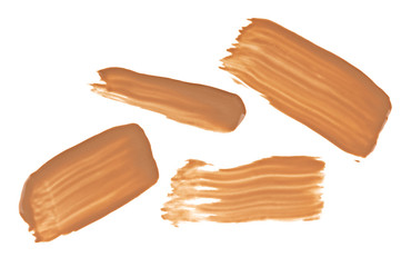 Beige tone cream (foundation) makeup samples, isolated on white