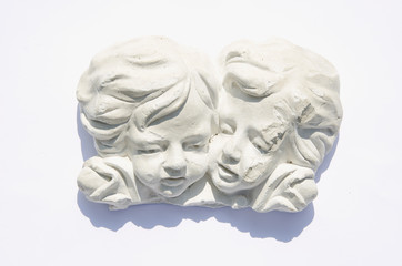 two retro plaster-cast angels heads