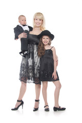 Fototapeta premium young mother and two children in formal clothes over white
