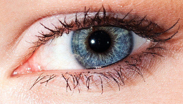 eye of beautiful young woman in studio