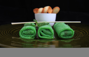 Indonesian Traditional Cake Dadar Gulung. beloved Indonesian traditional cake. green pancake...