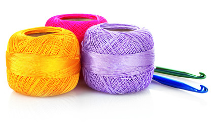 Few thread bobbins isolated on white