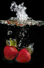 Fototapeta na wymiar Strawberries in water
