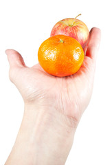 hand with orange and apple isolated on white background