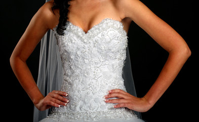 Сlose up of bride wearing wedding dress