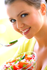 young beautiful woman eating healthy food