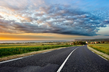 Sunset landscape with coastal road
