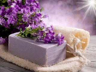 Obraz na płótnie Canvas natural flower soap with scrub sponge
