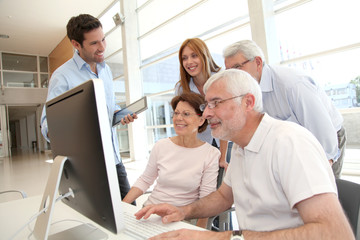 Senior people attending business training
