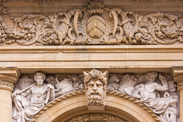 Stone carving on building exterior in Bristol UK