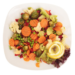 Salad on a plate with vegetables. Isolated on white