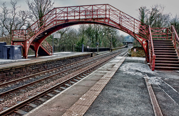 Fototapeta premium Old English railway platform bridge and lines