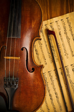 old used violin and note close up