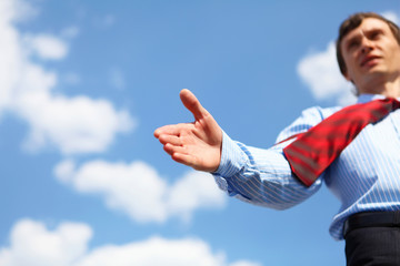 young businessman in a blue shirt and red tie