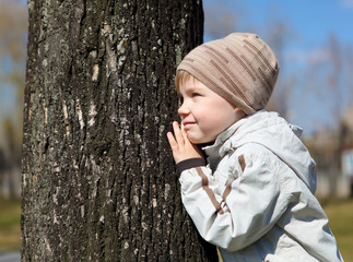 young boy walks in the park