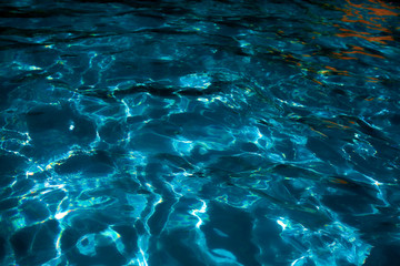 Waves in night pool