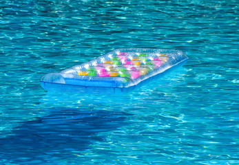 Inflatable mattress in pool