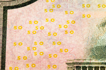 Fifty American dollars  (focus in  center)